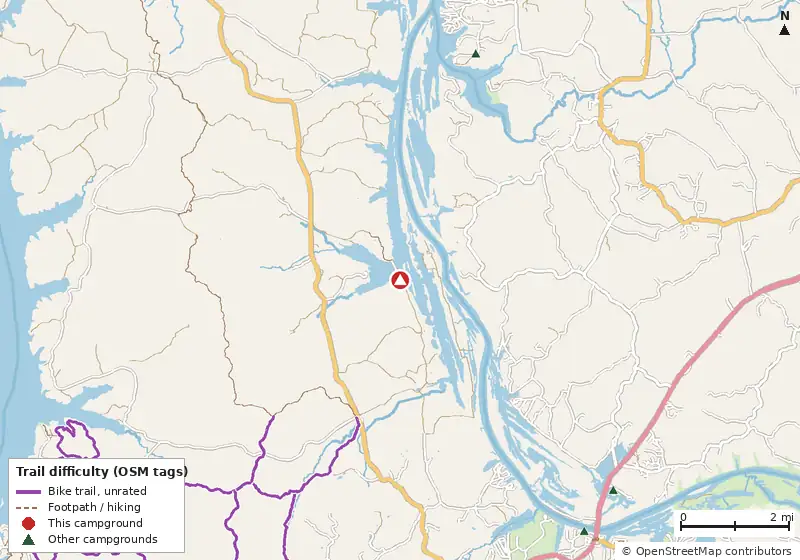 Map of roads, water and trails within about 5 miles of Gatlin Point Campground at Land Between The Lakes, with bike trails colored by their OpenStreetMap difficulty tags