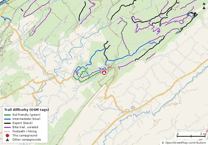 Map of roads, water and trails within about 5 miles of Greenwood Furnace Camp, with bike trails colored by their OpenStreetMap difficulty tags