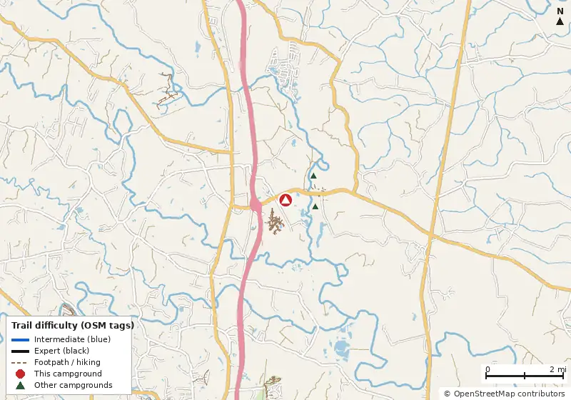 Map of roads, water and trails within about 5 miles of Kings Dominion Camp Wilderness Campground KOA, with bike trails colored by their OpenStreetMap difficulty tags