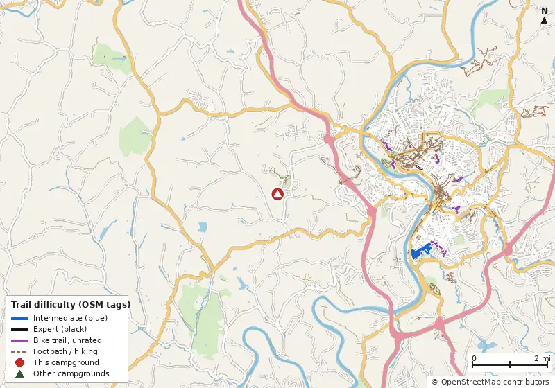 Map of roads, water and trails within about 5 miles of KOA Holiday, with bike trails colored by their OpenStreetMap difficulty tags