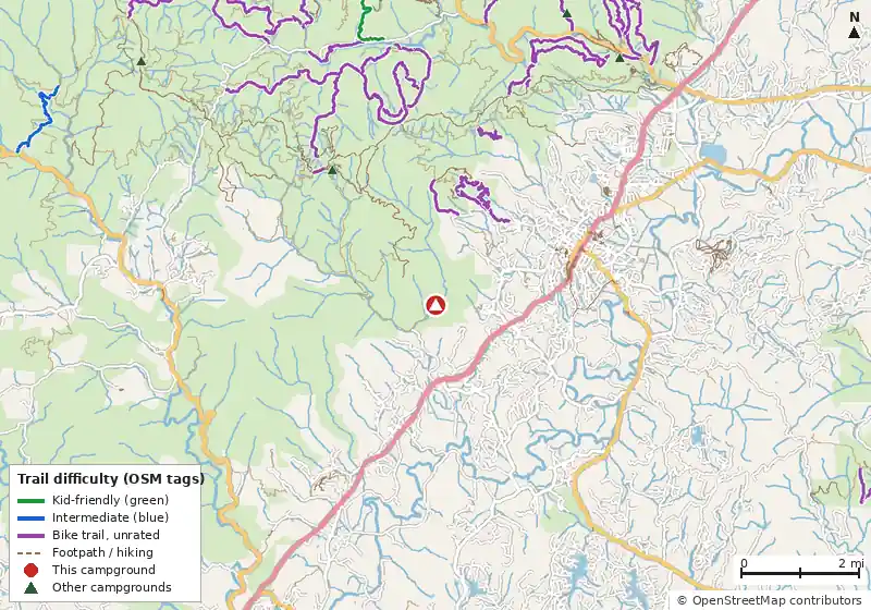 Map of roads, water and trails within about 5 miles of Kuykendall Group Camp, with bike trails colored by their OpenStreetMap difficulty tags