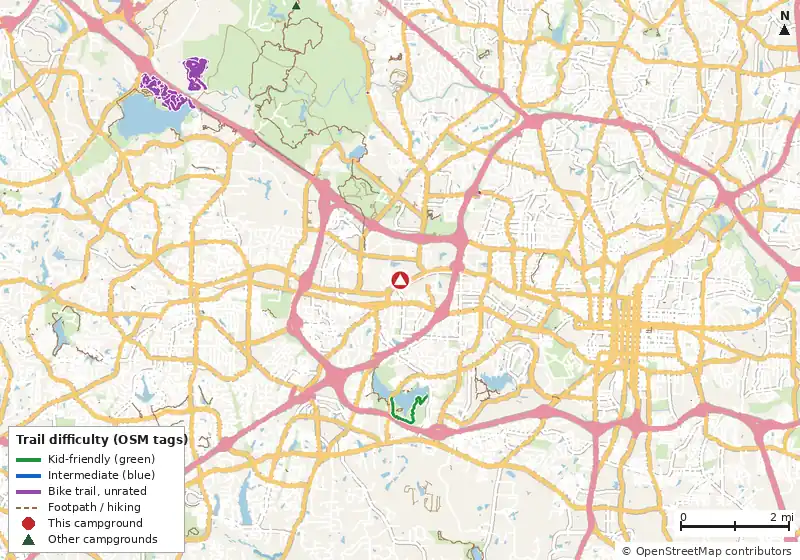Map of roads, water and trails within about 5 miles of North Carolina State Fairgrounds Campground, with bike trails colored by their OpenStreetMap difficulty tags