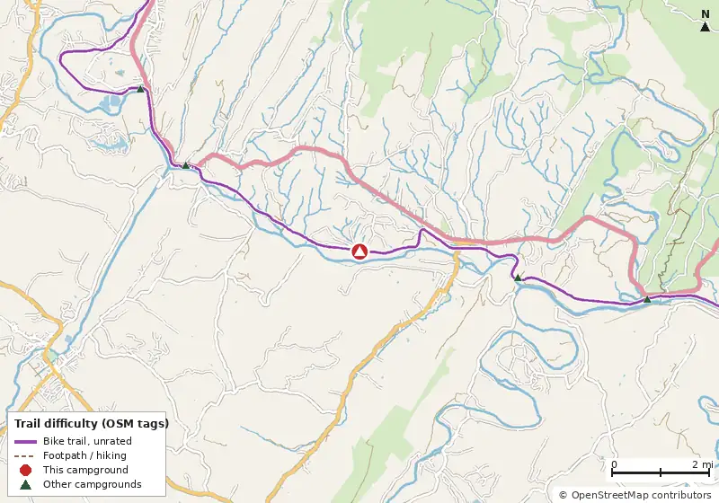 Map of roads, water and trails within about 5 miles of Pigmans Ferry Hiker-Biker Campsite, with bike trails colored by their OpenStreetMap difficulty tags
