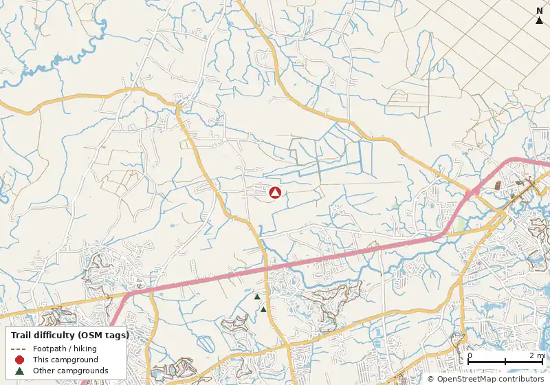 Map of roads, water and trails within about 5 miles of Whispering Pines Nudist Resort