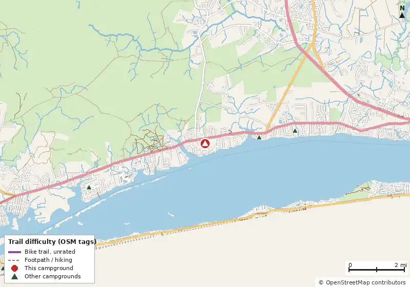 Map of roads, water and trails within about 5 miles of Whispering Pines RV Park & Campground, with bike trails colored by their OpenStreetMap difficulty tags