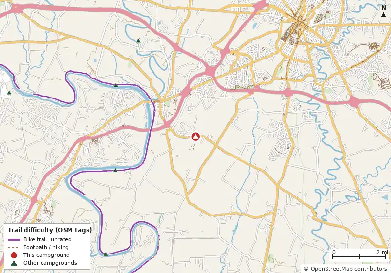 Map of roads, water and trails within about 5 miles of Yogi Bear's Jellystone Park, with bike trails colored by their OpenStreetMap difficulty tags